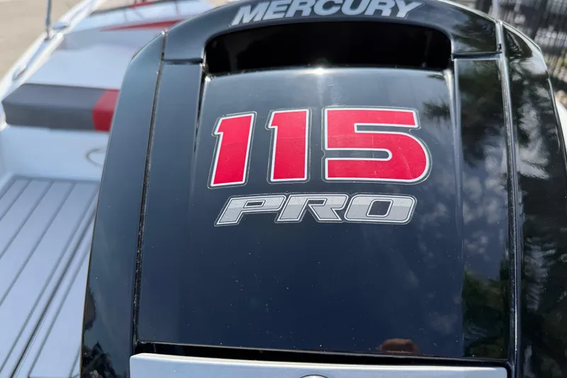 Slide: The Image of Mercury 115 Pro engine on 2023 Tahoe T18 boat, close-up view. - 15