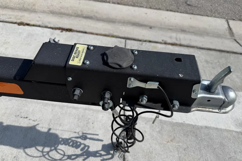Slide: The Image of Trailer hitch of a 2023 Tahoe T18, featuring disc brake readiness. - 19
