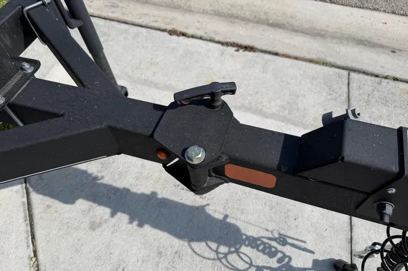 Slide: The Image of Trailer hitch of a 2023 Tahoe T18 on a concrete surface. - 20