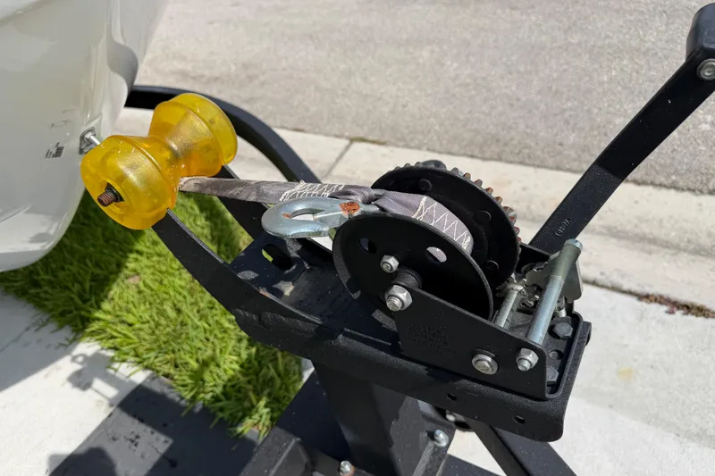 Slide: The Image of Trailer winch mechanism on a 2023 Tahoe T18 boat trailer. - 21