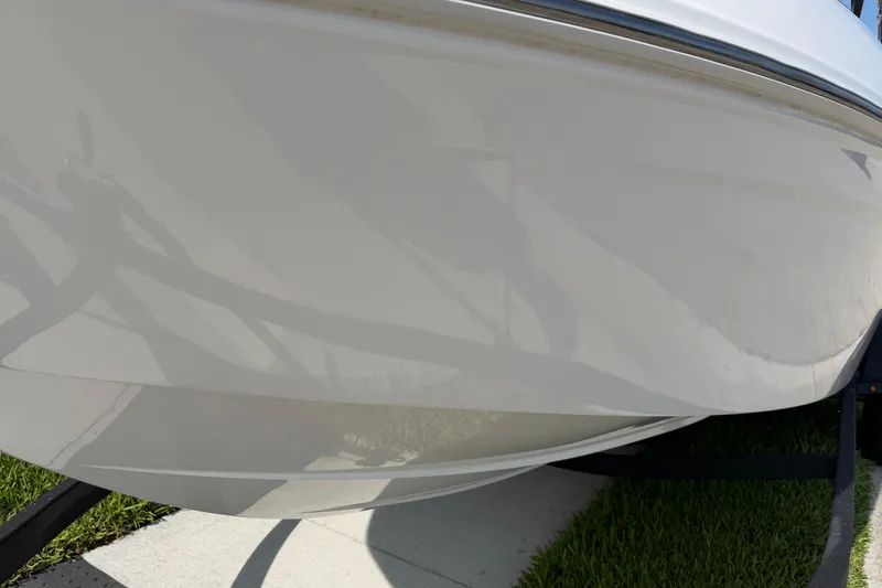 Slide: The Image of 2023 Tahoe T18 boat hull on trailer, close-up view. - 22