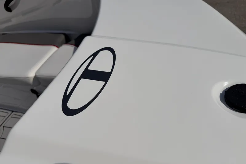 Slide: The Image of 2023 Tahoe T18 boat deck with logo, featuring sleek white design. - 24