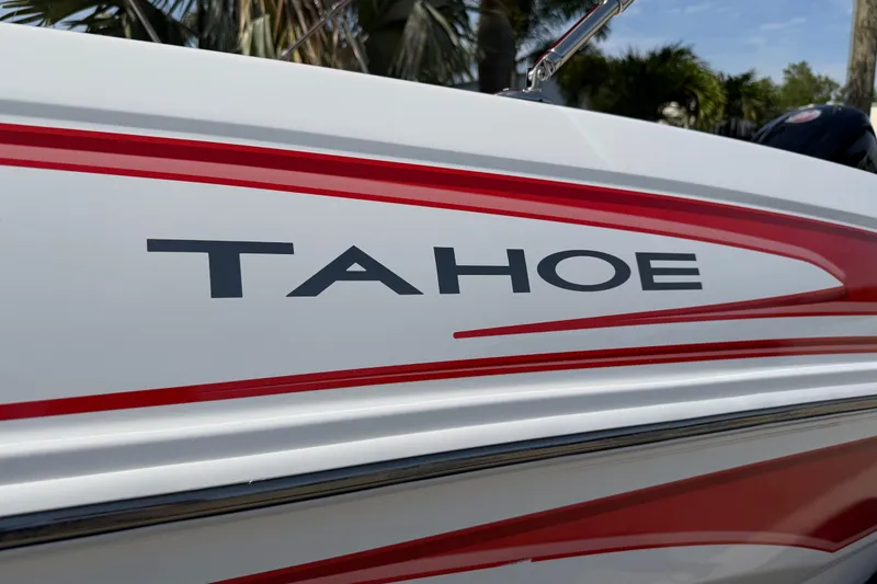 Slide: The Image of 2023 Tahoe T18 boat with red accents and logo detail. - 25