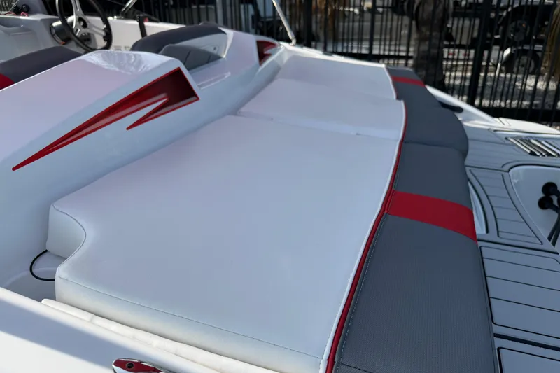 Slide: The Image of 2023 Tahoe T18 boat interior with white and red cushioned seating. - 28