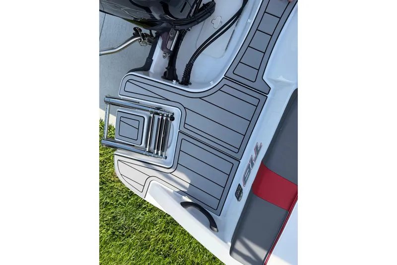 Slide: The Image of 2023 Tahoe T18 boat deck with ladder and sleek design. - 30