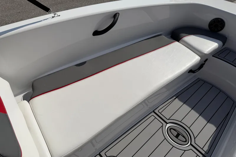 Slide: The Image of 2023 Tahoe T18 boat interior with cushioned seating and sleek flooring design. - 36