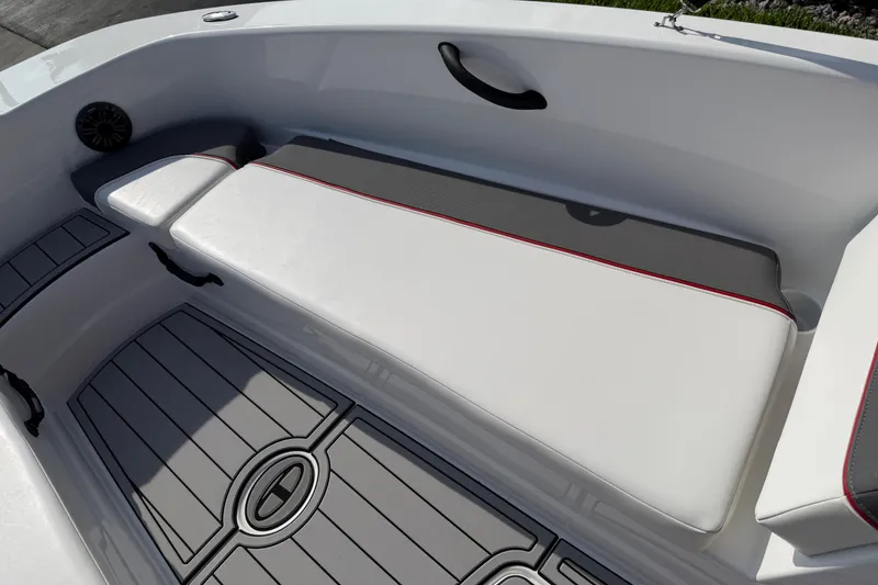 Slide: The Image of 2023 Tahoe T18 boat interior with cushioned seating and sleek flooring design. - 37