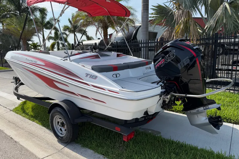 Slide: The Image of 2023 Tahoe T18 boat with red accents and Mercury Pro XS engine. - 4