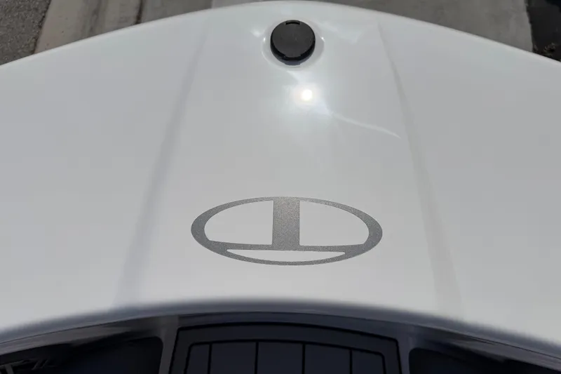 Slide: The Image of 2023 Tahoe T18 boat with logo on white surface, viewed from above. - 40