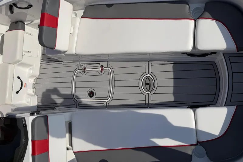 Slide: The Image of 2023 Tahoe T18 boat interior with gray and white seating, red accents, and sleek flooring design. - 42