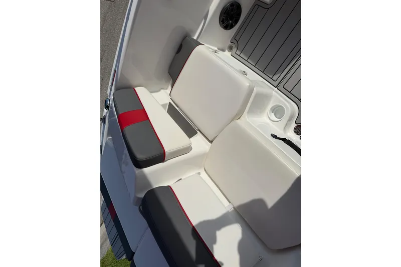 Slide: The Image of 2023 Tahoe T18 boat interior with white and red cushioned seating. - 44