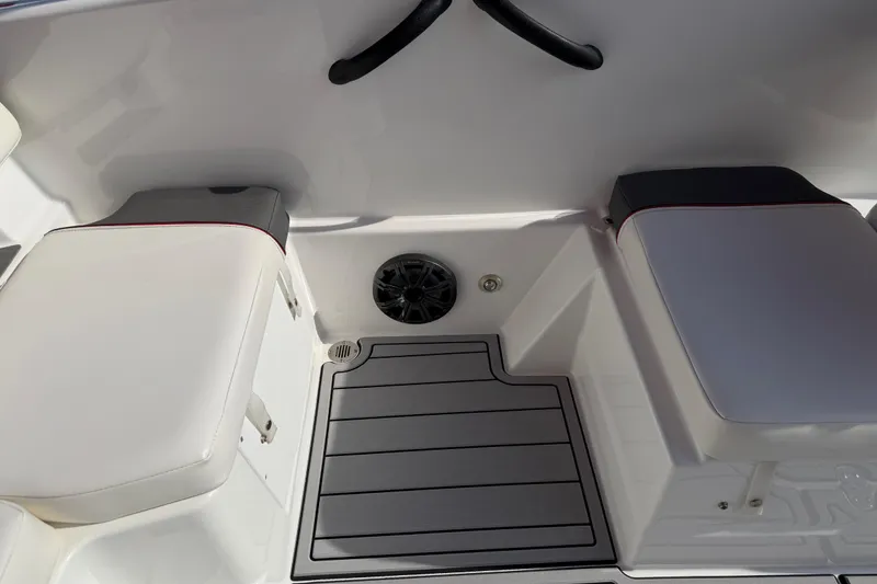 Slide: The Image of 2023 Tahoe T18 boat interior with cushioned seating and speaker system. - 46
