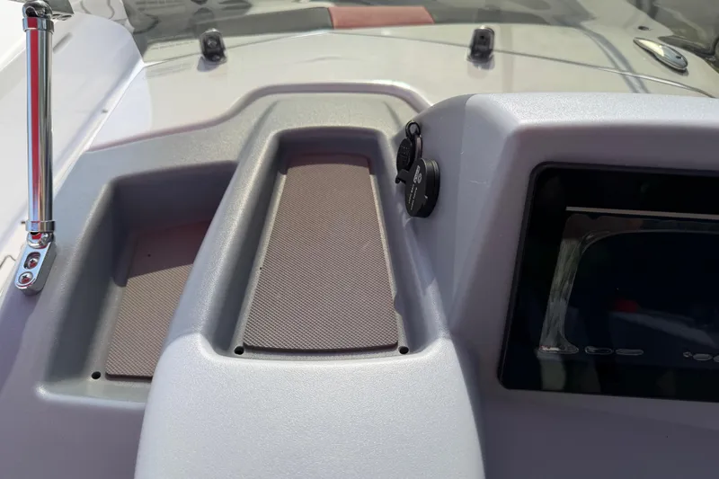 Slide: The Image of 2023 Tahoe T18 dashboard with control panel and storage compartments. - 59