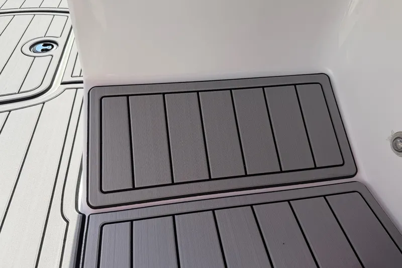Slide: The Image of 2023 Tahoe T18 boat deck with sleek, modern gray flooring design. - 60