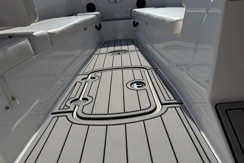 Slide: The Image of 2023 Tahoe T18 boat interior with sleek, modern flooring and cushioned seating. - 61