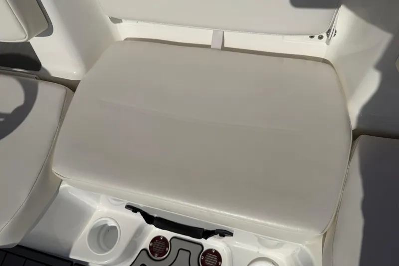 Slide: The Image of 2023 Tahoe T18 boat seat with cup holders and white upholstery. - 66