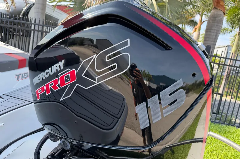 Slide: The Image of Mercury Pro XS 115 engine on 2023 Tahoe T18 boat, with sleek black and red design. - 7