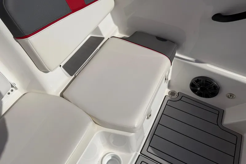 Slide: The Image of 2023 Tahoe T18 boat interior with cushioned seating and speaker. - 72