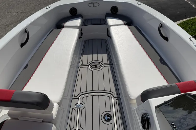 Slide: The Image of 2023 Tahoe T18 boat interior with white seating and gray flooring. - 74