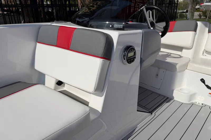 Slide: The Image of 2023 Tahoe T18 boat interior with modern seating and dashboard controls. - 78
