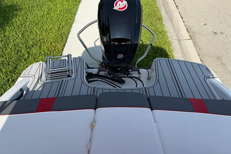 Slide: The Image of 2023 Tahoe T18 boat with outboard motor and swim platform. - 83