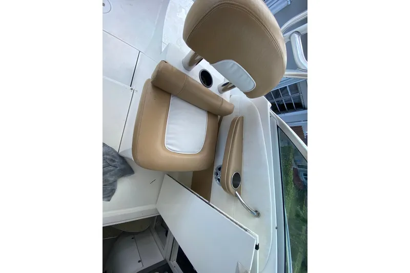 Slide: The Image of 2002 Wellcraft 290 Coastal boat interior with tan and white seating. - 28