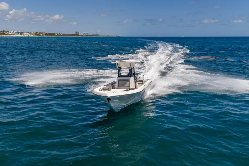 Slide: The Image of 2026 Sea Born LX27 Center Console cruising on open ocean waters. - 14