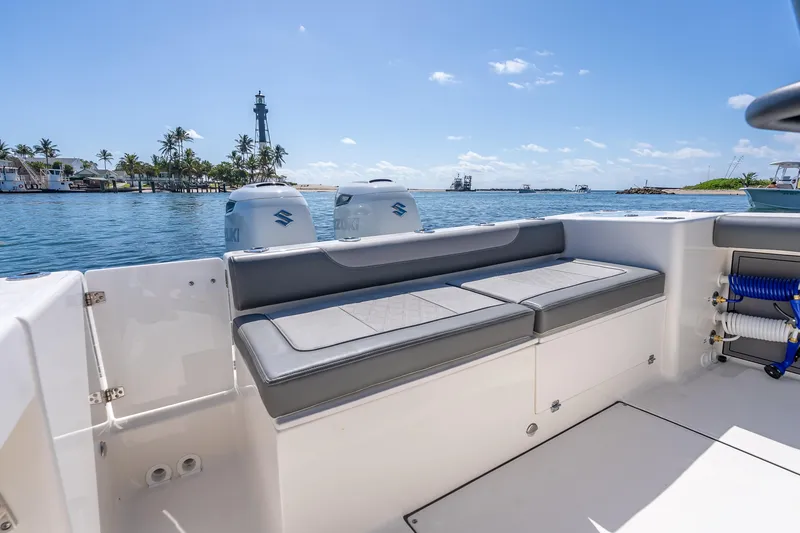 Slide: The Image of 2026 Sea Born LX27 Center Console boat with seating, ocean view, and lighthouse in background. - 24