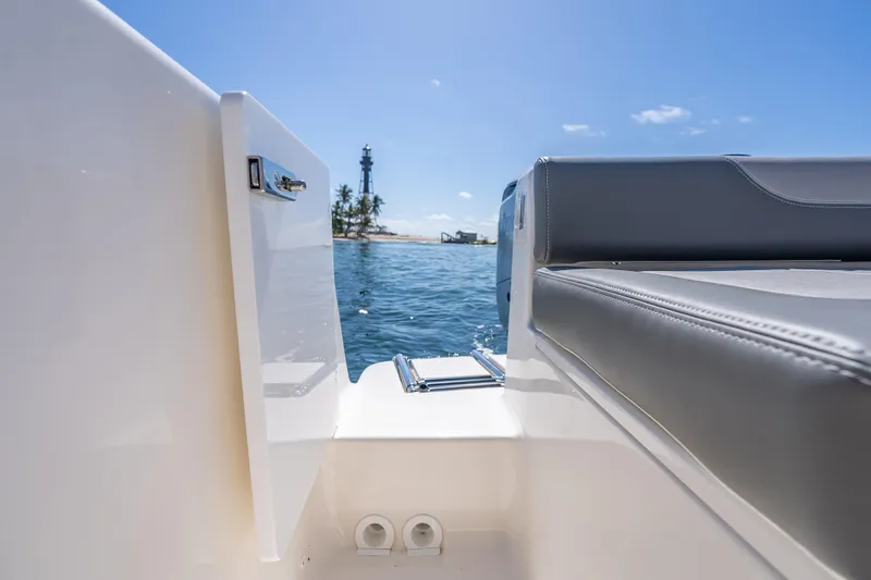 Slide: The Image of 2026 Sea Born LX27 Center Console boat with ocean view and distant lighthouse. - 28