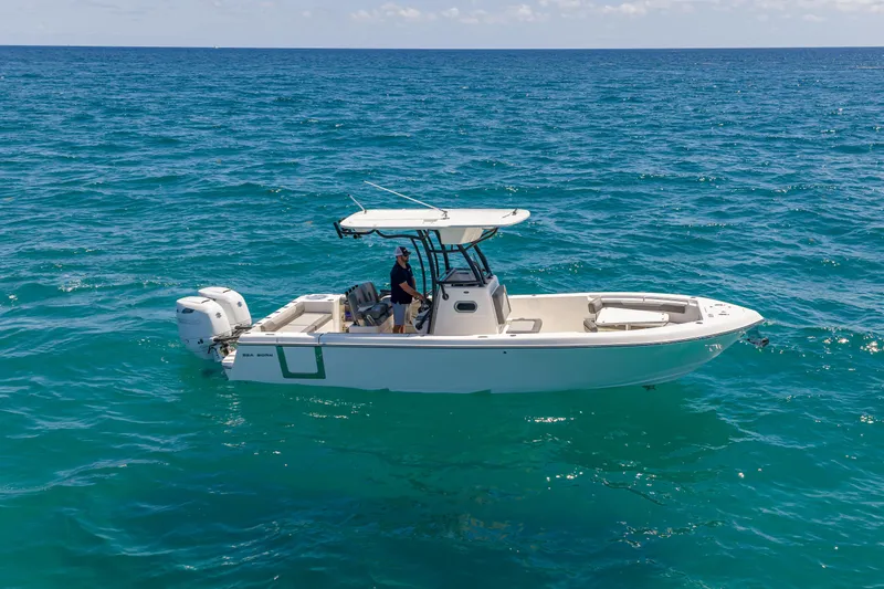 Slide: The Image of 2026 Sea Born LX27 Center Console boat cruising on open ocean waters. - 3