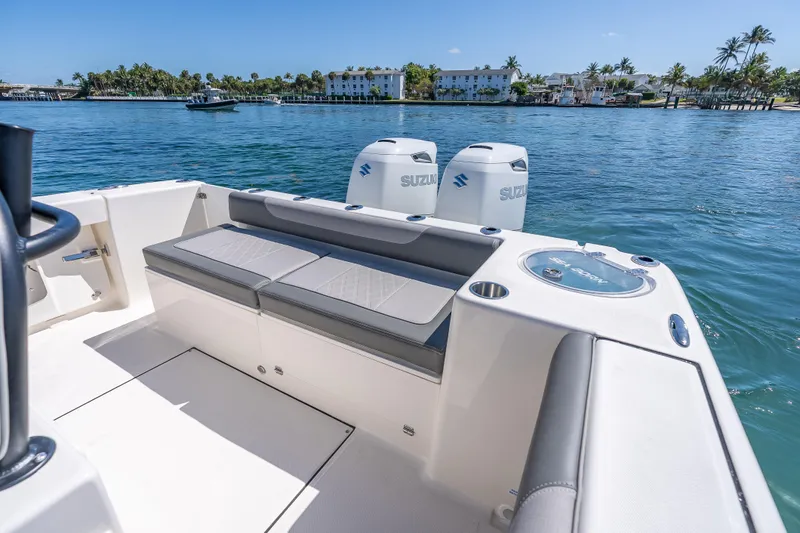 Slide: The Image of 2026 Sea Born LX27 Center Console boat with Suzuki engines on a sunny day. - 31