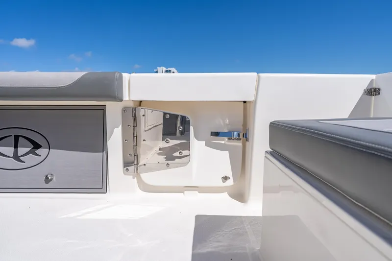 Slide: The Image of 2026 Sea Born LX27 Center Console boat interior with storage compartment and seating. - 32