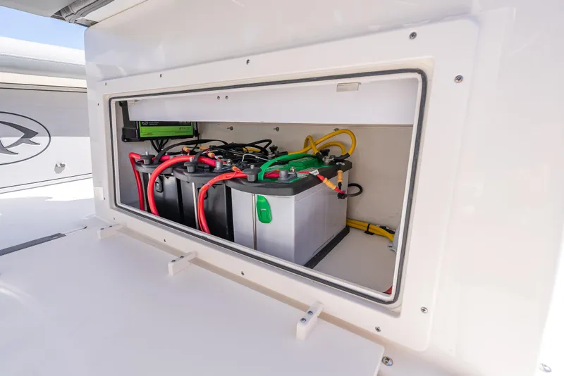 Slide: The Image of 2026 Sea Born LX27 Center Console boat battery compartment with wiring. - 37