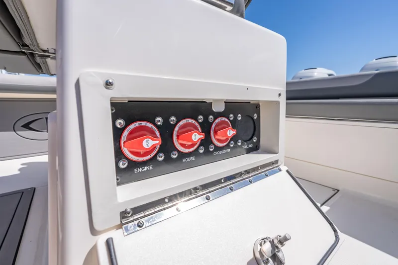 Slide: The Image of Control panel on 2026 Sea Born LX27 Center Console boat, featuring engine and house switches. - 38