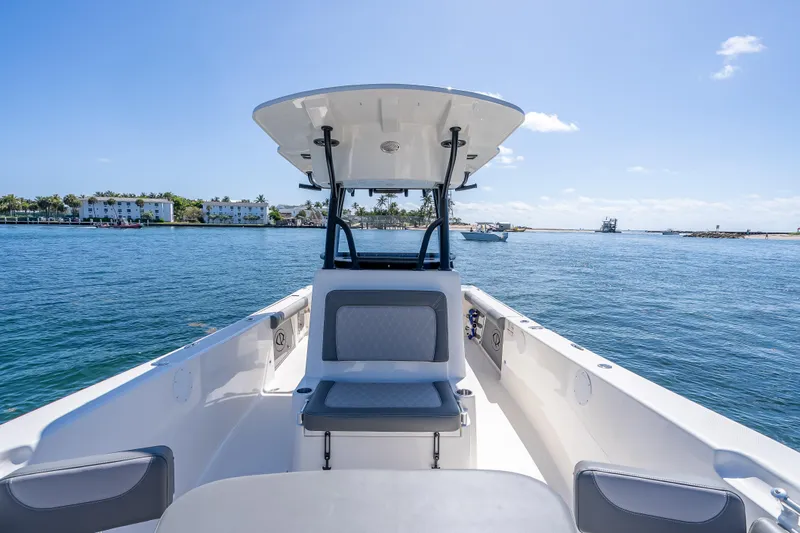 Slide: The Image of 2026 Sea Born LX27 Center Console boat on calm waters under clear blue sky. - 41