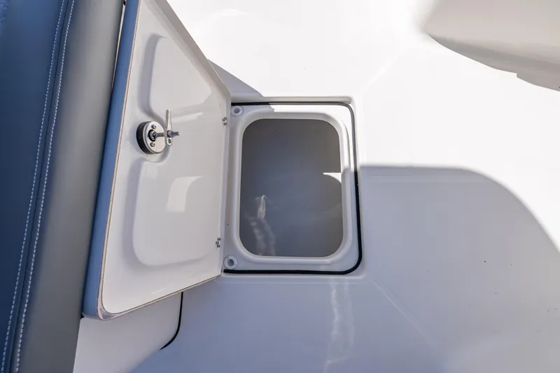 Slide: The Image of Open storage compartment on 2026 Sea Born LX27 Center Console boat. - 43
