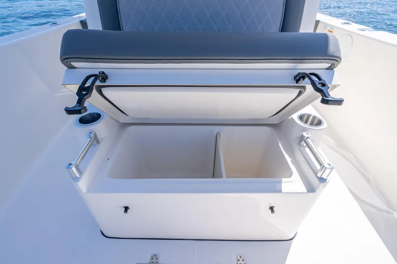Slide: The Image of 2026 Sea Born LX27 Center Console boat storage compartment with open lid. - 44