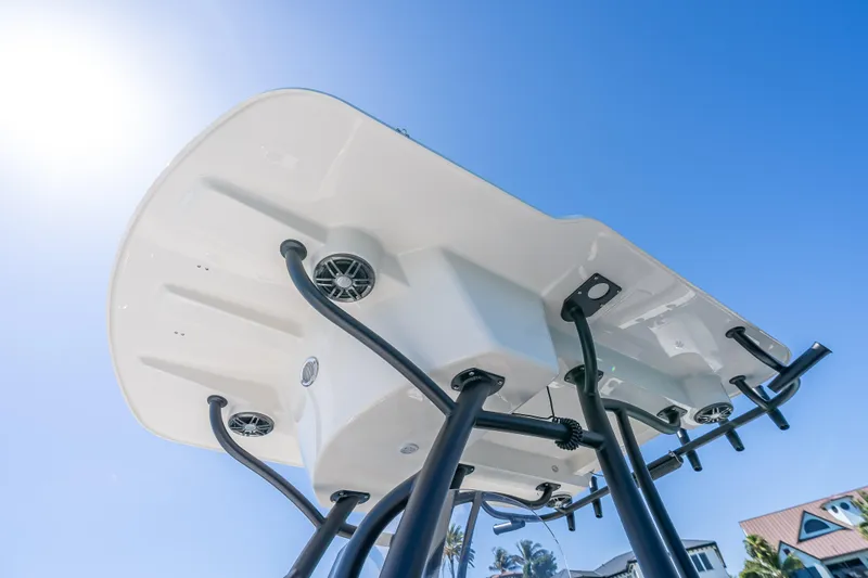 Slide: The Image of 2026 Sea Born LX27 Center Console boat, viewed from below against a clear blue sky. - 45