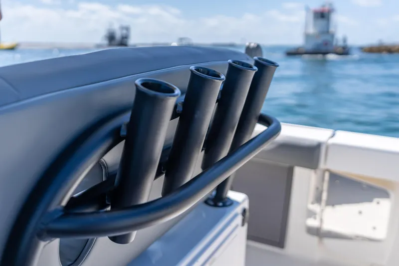 Slide: The Image of Rod holders on a 2026 Sea Born LX27 Center Console boat, ocean in background. - 52
