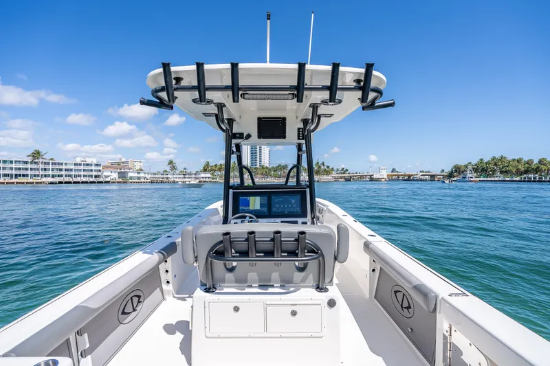 Slide: The Image of 2026 Sea Born LX27 Center Console boat on calm waters, clear sky background. - 53