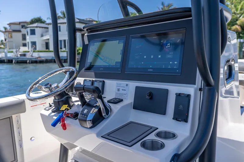 Slide: The Image of 2026 Sea Born LX27 Center Console boat dashboard with modern controls and dual screens. - 57