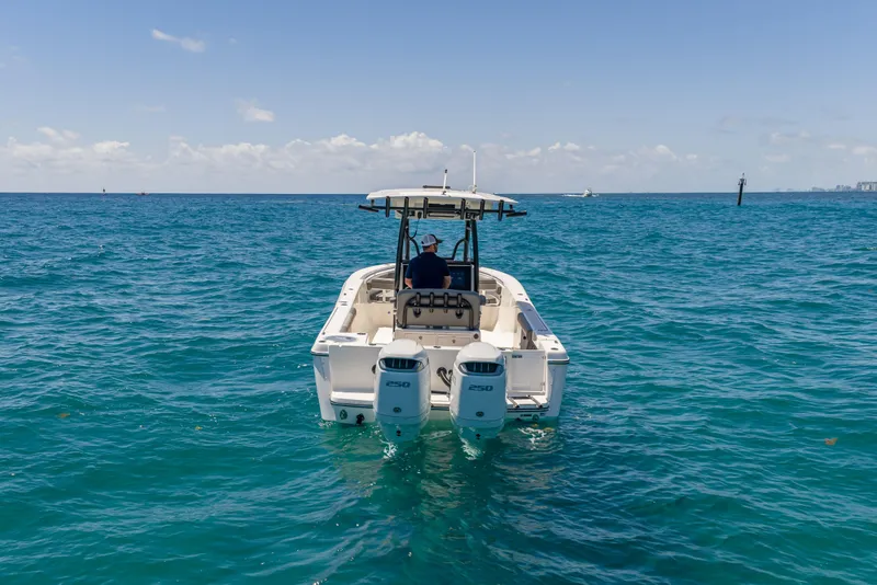 Slide: The Image of 2026 Sea Born LX27 Center Console boat on open ocean waters. - 7