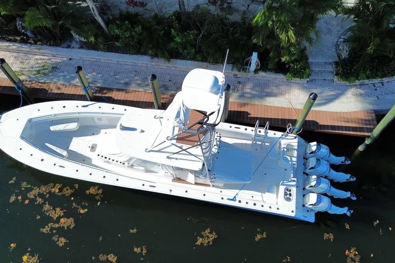 Slide: The Image of Aerial view of 2014 SeaHunter 45 Tournament boat docked by a wooden pier. - 14