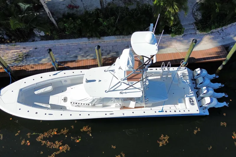 Slide: The Image of Overhead view of 2014 SeaHunter 45 Tournament boat docked, featuring multiple outboard engines. - 15