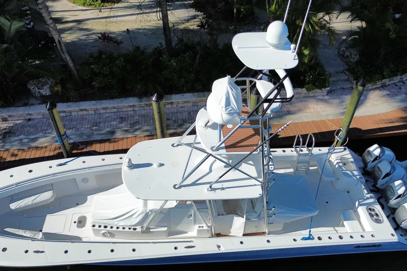 Slide: The Image of 2014 SeaHunter 45 Tournament boat docked, aerial view showcasing deck and tower. - 16