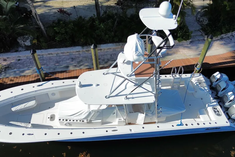 Slide: The Image of 2014 SeaHunter 45 Tournament boat docked, aerial view showcasing sleek design and spacious deck. - 18