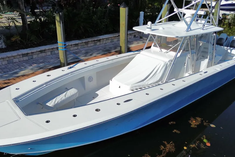 Slide: The Image of 2014 SeaHunter 45 Tournament boat docked, featuring sleek design and spacious deck. - 20