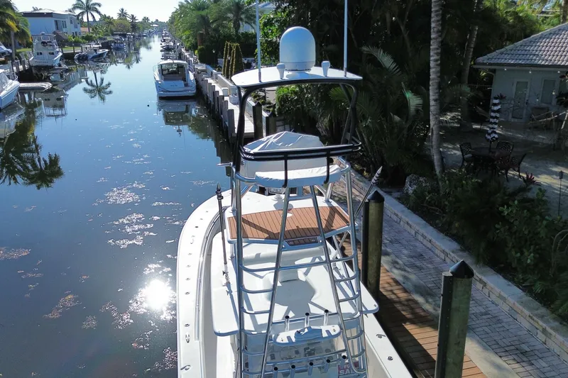 Slide: The Image of 2014 SeaHunter 45 Tournament boat docked in a scenic canal setting. - 21