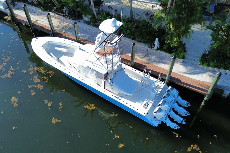 Slide: The Image of Aerial view of 2014 SeaHunter 45 Tournament boat docked by lush greenery. - 22