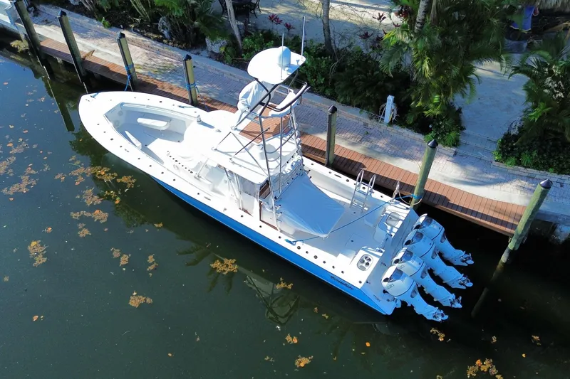Slide: The Image of Aerial view of 2014 SeaHunter 45 Tournament boat docked by lush greenery. - 23